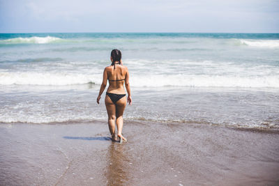 Woman standing on beach