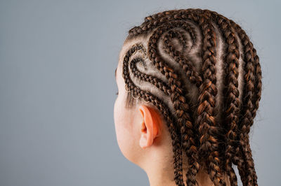 Close-up of woman with braided hair