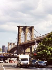 Bridge against sky in city