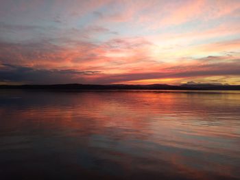 Scenic view of sea against romantic sky at sunset