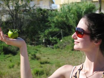 Close-up of young woman wearing sunglasses