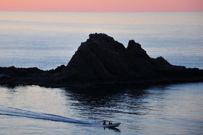 Scenic view of sea against sky at sunset
