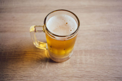 High angle view of beer glass on table