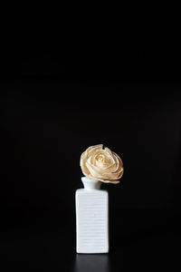 Close-up of coffee cup against black background