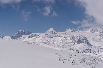 Scenic view of snowcapped mountains against sky