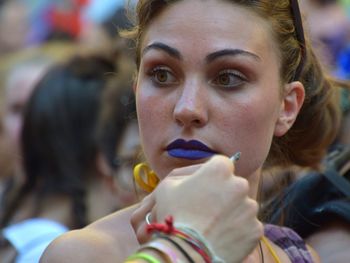 Close-up portrait of woman holding ice cream