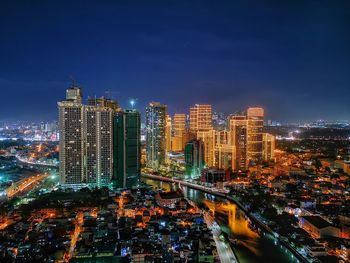 High angle view of cityscape against sky at night
