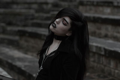 Young female model posing on steps