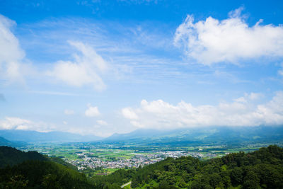 Aerial view of townscape against sky