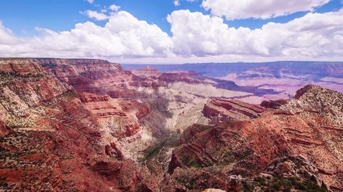 Scenic view of dramatic landscape against cloudy sky