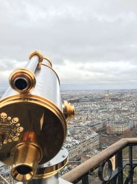 View of cityscape against cloudy sky