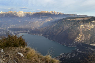 Scenic view of lake and mountains against sky