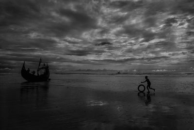 Scenic view of sea against cloudy sky