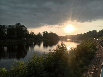 Scenic view of lake at sunset