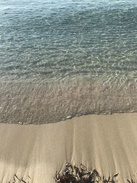 High angle view of surf on beach