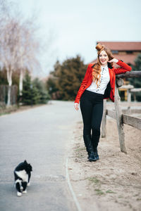 Portrait of young woman standing outdoors