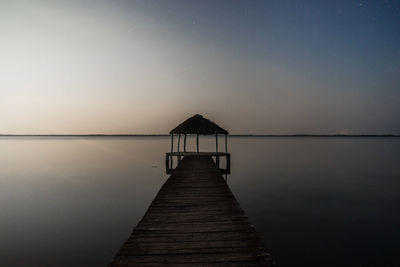 Empty jetty leading to sea