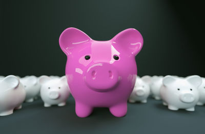 Close-up of pink toys against black background