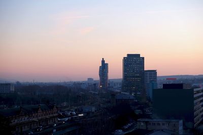 High angle view of buildings against sky during sunset