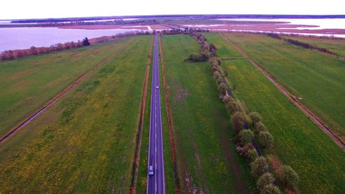 Panoramic view of agricultural field against sky