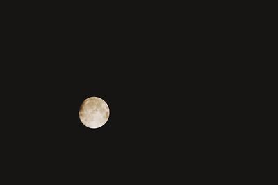 Low angle view of moon against clear sky at night