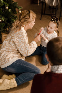 High angle view of mother and daughter at home