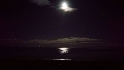 Scenic view of sea against sky at night