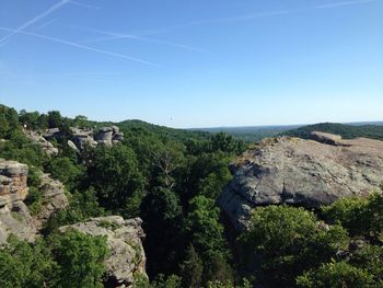 Scenic view of mountains against clear blue sky