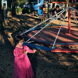 High angle view of girl playing on field at park