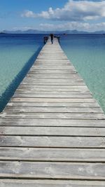 View of jetty leading to sea