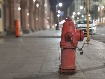 Red fire hydrant on footpath