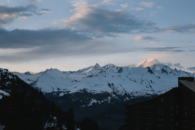 Scenic view of snowcapped mountains against sky