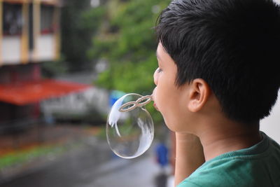 Portrait of boy drinking water
