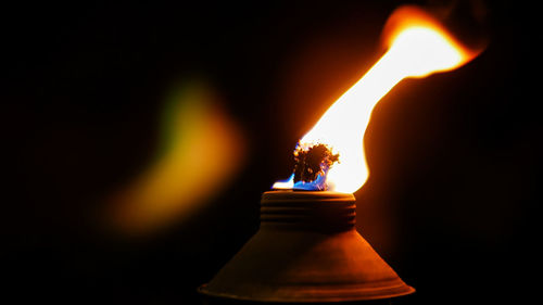 Close-up of burning candle