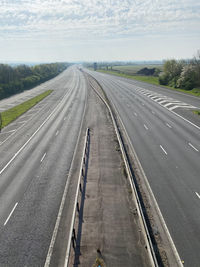 Empty road against sky