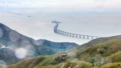 Scenic view of long bridge on the sea cloudy sky background in the rain season at hong kong 