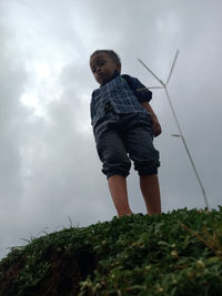 Low angle view of child standing on ground