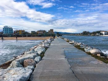 Stone pier on the adriatic coast in rimini. end of season