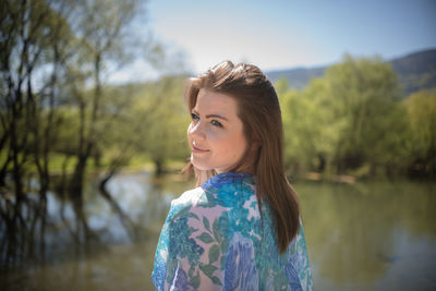 Woman sitting on retaining wall