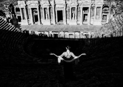 Woman in traditional clothing at night