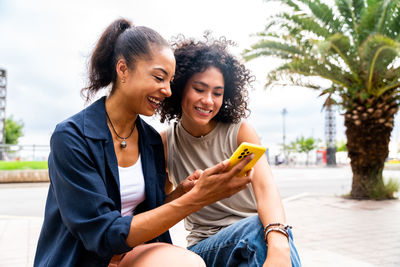 Young woman using mobile phone