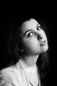 Close-up portrait of a young woman looking away