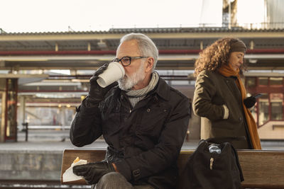 Man waiting on train station platform