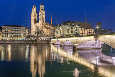 Reflection of illuminated buildings in water