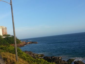 Scenic view of sea against clear blue sky