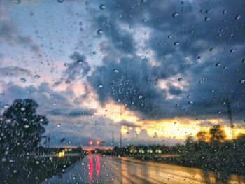 Raindrops on glass window of rainy season