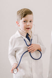 Young child in labcoat with stethoscope