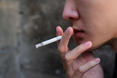 Close-up of woman smoking cigarette