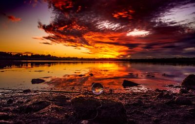 Scenic view of lake with reflection during sunset