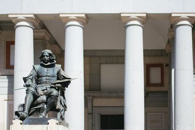 Low angle view of statue against building